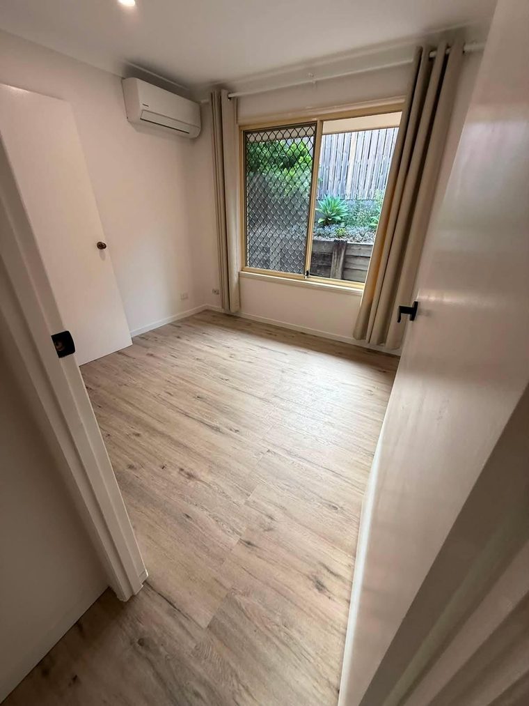 New hybrid flooring laid through a living area